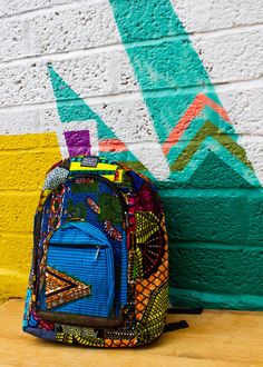 Patchwork Bag, African Print Backpack, Recycled Backpack Super colourful African print backpack made from recycled ankara fabrics. This high-quality patchwork backpack is the perfect size for a laptop and books with two front zipped compartments for all your little things.  - Colour Me Crazy patchwork fabric - Material made from recycled fabric pieces. - Lined for extra strength with recycled flour sacks from the Takoradi flour Mill in Ghana! - Two front pockets and main compartment - Adjustable Eco-friendly Multicolor School Backpack, Patchwork Backpack, Recycled Accessories, Flour Sacks, Ankara Bags, Boho Backpack, African Bag, Nursery Bag, African Accessories