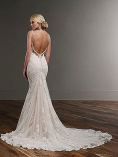 a woman in a wedding dress looking back