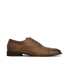 Tradition meets the modern moment with these essential tan oxfords. Crafted with Italian leather in a smooth two-tone cognac finish for added depth and rich color, a cap toe, and elevated stitch detailing, this classic dress shoe promises luxe style and a clean silhouette. This timeless light brown oxford shoe is perfect to pair with a full suit, dress pants, or more casual looks, easily dressed up or down. A leather lining and insole keep you comfortable on the dance floor, through the wedding Shoes For Suits, Tan Dress Shoes, Oxford Shoe, Perfect Tan, Tan Dress, Luxe Style, Suit Shoes, Suit Dress, Leather Oxford Shoes