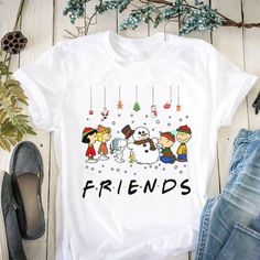 Friends Christmas Snoopy And Friends With Snowman T Shirt Design By Shitrless Fashion. With our wonderful selection of shirts, you may uplift your outfit. Our shirts, which are made of high-quality fabrics, provide unmatched comfort and timeless style. Our custom fit shirts are ideal for any setting and are made to enhance your appearance and self-confidence. Our shirts are the height of adaptability, whether you're dressing up for a formal occasion or choosing a more laid-back style. With our s Snoopy And Friends, Christmas Snoopy, Friends Christmas, Snoopy Christmas, Friends Tshirt, Friend Christmas, Laid Back Style, Unisex Shorts, Cartoon Styles