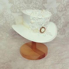 A rework of one of my most popular hats, this white and ivory hat is simply perfect for a Victorian or Steampunk bride! The handmade, milliners buckram hat is covered with faux silk in ivory or white.Then decorated with a heavy mix of lace, appliques, delicate ribbon roses and tiny diamante.MY HAT MEASUREMENTS AND SIZESThis is my shallow crown midi size hat, which measures 3” high by 7” wide at the brim base.All my hat designs can be made in larger and smaller sizes, please just send me a convo Mad Hat, Popular Hats, Alice Tea Party, Victorian Hats, Steampunk Hat, Hat Wedding, Summer Tea, Steampunk Wedding, Tea Party Hats