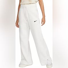 Nwt: Nike Sportswear Phoenix Fleece Women's High-Waisted Wide-Leg Sweatpants The Extra-Long, Wide Leg And Hem Vents Of These Phoenix Fleece Pants Let You Show Off Your Favorite Shoes While Taller Ribbing At The Waist And An Exaggerated Drawcord Ensure Your Look Is Anything But Basic. Smooth On The Outside And Cozy On The Inside, Brushed Fleece Is Our Go-To Sweatshirt Material For Colder Temperatures Elongated Ribbing At The Waist Provides Extra Comfort And Structure High-Rise Waistband Embroider White Full-length Sweatpants Sportswear, White Full-length Sportswear Sweatpants, White Full-length Sportswear Pants, White Wide Leg Sportswear Bottoms, White Fitted Sweatpants Sportswear, White Full Length Sweatpants For Sports, White Full-length Sporty Bottoms, White Full Length Sporty Bottoms, Casual White Full-length Activewear