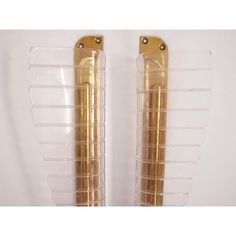 pair of gold tone metal and acrylic bookends