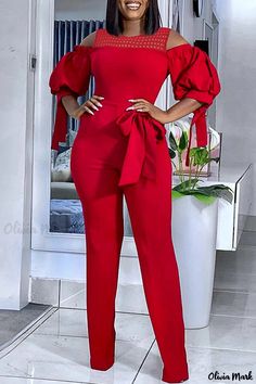 Olivia Mark - An Elegant and Chic Womens Red Solid O-Neck Patchwork Casual Jumpsuit with Detailed Hollowed Out Bandage Red Party Jumpsuits And Rompers, Red Non-stretch Jumpsuits And Rompers, Red Solid Color Jumpsuits And Rompers For Spring, Red Fitted V-neck Jumpsuit, Red V-neck Jumpsuit And Romper, Red V-neck Fitted Jumpsuit, Fitted Red Jumpsuits And Rompers, Red Fitted V-neck Jumpsuits And Rompers, Elegante Y Chic