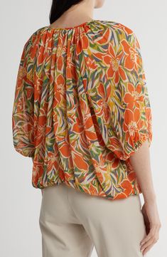 A fabulous floral print covers this ultralightweight top designed with a split neckline and ties. 23 1/2" length Split neck with ties Elbow-length sleeves 100% polyester Machine wash, line dry Made in the USA Spring Beach Blouse With Abstract Print, Summer Printed Tie Neck Tops, Printed Tie Neck Tops For Summer, Summer Floral Print Tie Neck Top, Multicolor Floral Print Blouse With Split Neck, Multicolor Split Neck Blouse With Floral Print, Floral Print Rayon Tops, Floral Print Patterned Rayon Tops, Patterned Floral Print Rayon Tops