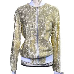 Oversized Slouchy Sequin Bomber With Ribbed Crew Neck And Wrists. Lined With Ivory White Satin-Finish Fabric, Two Outer Pockets At Sides, Plus One Inner Pocket. . Men's Small 19 1/2“ Pit To Pit* 26“ Length* Brand New With Tags Attached; One Very Light Marking On Ribbing At Rear Waist- See Pics For Details *Approximate Gold Long Sleeve Outerwear For Spring, Ivory White, White Satin, Satin Finish, Martini, Mens Jackets, Zip Ups, Sequin, Bomber Jacket