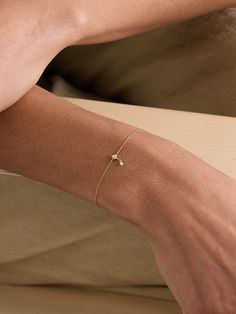 Part of the celestial 'Séléné' collection, Persée's bracelet features a North star pendant that symbolizes direction and guidance. It's made from 18-karat gold and inlaid with 0.06-carats of shimmering diamonds that twinkle like the night sky. Adjust yours to find a comfortable fit. Deepika Bracelet, One Diamond Bracelet, Dainty Jewelry Stack, Dainty Diamond Bracelets, Delicate Jewelry Aesthetic, Bracelet Aesthetic Gold, Earrings Shoot, Simple Jewerly, Dainty Fine Jewelry