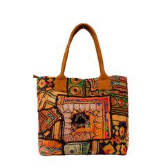 This bohemian banjara bag is the perfect accessory for the bohemian fashionistas. Key Features: Hand made in India. Fair trade guaranteed. Zipper top. Inside zipper pocket. Size ( Approx ) Height - 12 Inches/30 Cm. Width - 15 Inches/38 Cm. Handle Length 10 inches/ 25 Cm.  Inside Pocket - 3 ( As you can see in the picture ) Zipper Pocket - 1 Made from vintage Banjara  mirror work embroidery, it's a strong bag, and the perfect size for all your essential everyday stuff and more.... You'll get a lo Rectangular Hobo Bag For Everyday Use And Festivals, Bohemian Brown Satchel With Double Handle, Brown Bohemian Satchel With Double Handle, Bohemian Hobo Tote Bag, Traditional Brown Tote Bag, Daily Use Tassel Tote Satchel, Handmade Tote Shoulder Bag For Festivals, Bohemian Brown Shoulder Bag With Double Handle, Multicolor Embroidered Shoulder Bag With Tassels