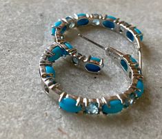 Beautiful Sterling Silver Blue Topaz Turquoise Open Back Setting Eternity Hoop Earrings See earrings next to ruler for scale Usa Jewelry, Coin Earrings, Sleeping Beauty Turquoise, Handcrafted Necklace, Rock Crystal, Earrings Photo, Silver Blue, Vintage Earrings, Ruler