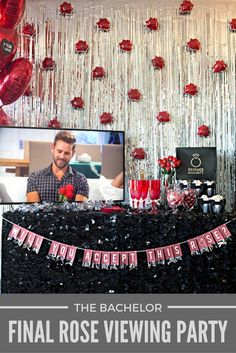 the bachelor's party is set up with balloons, streamers and red roses