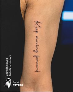 a woman's arm with chinese writing on it