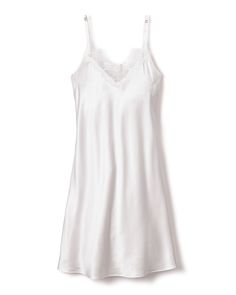 Petite Plume wishes you a “bonne nuit,” and in their luxury sleepwear, it’s hard not to oblige. Crafted from the softest 100% 22mm Mulberry silk, the Women's Silk Lace Slip Dress in White is the quintessential minimalist combination of luxury and grace. This stunning piece features delicate spaghetti straps, sweetheart neckline, and a body skimming tea length silhouette. Product Details 100% Mulberry silk. Care Instructions Wash only by hand or in a laundry bag in the washer in cold water. Dry f Silk V-neck Sleepwear For Bedtime, Elegant V-neck Nightgown For Sleep, Feminine Sleepwear With Satin Finish, Feminine Silk Sleepwear, Elegant Slip Dress For Loungewear, Feminine Silk Nightgown For Loungewear, Silk V-neck Sleepwear For Wedding Night, Elegant Satin Nightgown For Sleep, Elegant Sleeveless Silk Sleepwear