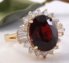 10.10 Carats Impressive Red Garnet and Natural Diamond 14K Yellow Gold Ring Suggested Replacement Value: $6,200.00 Total Natural Oval Red Garnet Weight is: Approx. 9.00 Carats Garnet Measures: Approx. 14.00 x 12.00mm Natural Round & Baguette Diamonds Weight: Approx. 1.10 Carats (color G-H / Clarity SI1-SI2) Ring total weight: Approx. 6.0 grams Disclaimer: all weights, measurements and colors are approximate and may vary slightly from the listed dimensions or as seen in the image. All picture Luxury Red Ruby Ring For Formal Occasions, Luxury Red Gemstone Diamond Ring, Luxury Red Diamond Ring With Gemstone, Luxury Red Ruby Ring For Anniversary, Red Brilliant Cut Diamond Ring For Formal Occasions, Red Brilliant Cut Diamond Ring For Formal Events, Formal Red Gemstone Brilliant Cut Diamond Ring, Luxury Red Diamond Ring With Polished Finish, Luxury Red Diamond Ring For Anniversary