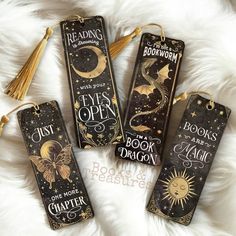 three bookmarks with the words, eyes open and one has a dragon on it