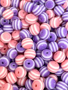 purple and pink striped beads are shown close up