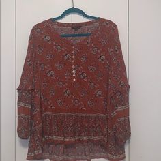 Brand: American Eagle Size: Xl Detail: Burnt Orange Floral High-Low Blouse (Buttons Come Undone At Top) ** Brand New Without Tags ** Casual Flowy Patterned Peasant Top, Casual Patterned Peasant Top For Fall, Casual Long Sleeve Blouse With Boho Print, Casual Long Sleeve Boho Print Blouse, Casual Patterned Flowy Peasant Top, Casual Tunic Peasant Top For Fall, Casual Flowy Boho Print Blouse, Flowy Boho Print Casual Blouse, Casual Flowy Patterned Blouse