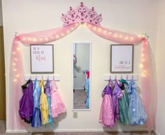 25+ Magical Princess Room Decor Ideas for Your Little Lady Princess Dress Wall, Dress Up Room Ideas, Disney Princess Nursery Baby Girl, Dress Up Wall Ideas, Disney Princess Kids Room, Disney Princess Bedroom Ideas Toddler, Dress Up Area Girls Room, Dress Up Corner For Girls Room, Girls Dress Up Area