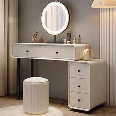 a white dressing table with a round mirror above it