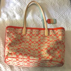 Nwot Coach Legacy Weekend Shopper Bag In Coral And Aqua. Never Used. Coach Orange Shoulder Bag, Coach Shoulder Bag For Spring Travel, Spring Coach Shoulder Bag For Travel, Orange Double Handle Bag For Errands, Orange Shoulder Bag For Everyday Use, Coach Orange Satchel Bag, Orange Bag With Removable Pouch For Errands, Orange Bag With Handle Drop For Daily Use, Orange Double Handle Shoulder Bag For Errands