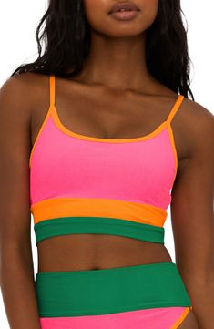 A color-blocked design defines this ribbed bikini top that's ready for some fun in the sun. Lined Adjustable straps 82% polyester, 18% spandex Hand wash, dry flat Made in the USA Sporty Multicolor Triangle Top Swimwear, Pink Nylon Sports Bra For Summer, Sporty Multicolor Swimwear For Sunbathing, Sporty Color Block Swimwear For Sunbathing, Summer Athleisure Multicolor Sports Bra, Multicolor Athleisure Sports Bra For Summer, Sporty Green Color Block Swimwear, Sporty Multicolor Color Block Swimwear, Sporty Ribbed Sports Bra For Summer