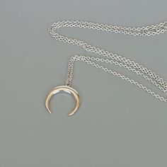 A Sterling silver neck chain with a crescent moon charm. Dimensions: 14.5 x 15.5 mm Length: 16 to 17 inches This necklace is made of 925 hypoallergenic sterling silver. Most of my pieces come with a 925 stamp. Please go through all the pictures posted for this item to gauge the actual size. Can be packaged in a gift box. I can include a personal message from you if needed You are welcome to contact me at... bhavnakwintra1956@gmail.com For more beautiful pieces from my shop, please browse 👇 SILV Silver Crescent Charm Necklace For Everyday Wear, Everyday Silver Crescent Charm Necklace, Minimalist Crescent Sterling Silver Jewelry, Silver Crescent Sterling Silver Charm Necklace, Minimalist Silver Jewelry With Moon Phase, Minimalist Silver Moon Phase Jewelry, Minimalist Nickel-free Crescent Jewelry, Minimalist Sterling Silver Moon Phase Charm Necklaces, Silver Crescent Moon Phase Charm Necklace