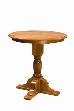 a round wooden table with two pedestals on one end and an oval base on the other