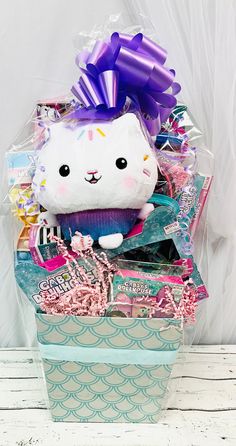 a gift basket with a stuffed animal in it