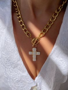 A handmade gold necklace with a unique Cross charm at the center that has a white type of stones on it that are made from enamel. The connection is at the front side with a circle part so it can not be adjusted. In Christina Christi Jewels store you can see more than 50 designs in Women's Necklaces. You can have them in 2-4 Days with DHL EXPRESS SHIPPING MATERIALS - Gold filled Chains are made from Aluminium. - White Cross charm made from brass with White type of stones on it (enamel). DIMENSION Handmade Yellow Gold Enamel Necklaces, Handmade Yellow Gold Enamel Necklace, White Plated Necklaces As Gift, Elegant Enamel Necklace With Chain, White Cross Pendant Clavicle Necklace, Gold Enamel Necklace With Chain, Enamel Chain Necklace For Gift, White Plated Pendant Necklaces, White Plated Pendant Necklace