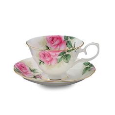 a cup and saucer with pink roses on it