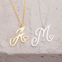 ✨ Introducing the stunning Initial Letter Necklace—a dazzling piece that adds a personal touch to your style! ✨ 🌟 Personalized Charm: Each necklace is delicately crafted to resemble your chosen initial, culminating in an adorable heart-shaped pendant. 💎 Alphabet Variety: Available for all letters from A to Z, ensuring everyone can find their perfect match. ✨ Elegant Finishes: Choose between radiant gold for warmth and luxury or timeless silver for purity and versatility. 🌈 Embrace the essence Necklaces Cheap, Letter Necklace Initials, Initial Heart Necklace, Initial Letter Necklace, Initial Necklaces, Letter Pendant Necklace, Initial Pendant Necklace, Custom Name Necklace, Letter Pendants