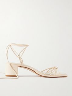 aeyde's collections marry "classic shapes and modern details". These 'Serafina' sandals have been made in Italy from buttery leather and have a knotted toe strap and long ties that wrap elegantly around the ankles. The low 55mm block heels offer comfortable lift. Square Toe Sandals For Summer Wedding, Summer Wedding Sandals With Square Toe, Summer Wedding Square Toe Sandals, Leather Sandals With Sculpted Heel For Wedding, Chic Leather Sandals For Wedding, Chic Leather Wedding Sandals, Leather Sandals With Wrapped Heel For Wedding, Cream Heels, Wrap Sandals