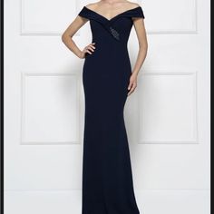 Upgrade Your Formal Wardrobe With This Stunning Rina Di Montella-Montage Gown, Perfect For Mothers Of The Bride. This Navy Blue Dress In Size 14 Features A Flattering Crepe Material That Feels Comfortable And Looks Elegant. The Designer/Brand Rina Di Montella Is Known For Creating Beautiful Formal Wear, And This Dress Is No Exception. Pair The Dress With Your Favorite Accessories And You'll Be Ready To Attend Any Wedding Or Formal Occasion. The Dress Is New With Tags And Comes From A Smoke-Free Elegant Mother Of The Bride Dress With Sweetheart Neckline, Elegant Maxi Dress With Sweetheart Neckline And Sweep Train, Formal Maxi Dress With Sweetheart Neckline And Sweep Train, Formal Maxi Dress With Sweep Train And Sweetheart Neckline, Elegant Blue Maxi Dress With Sweetheart Neckline, Elegant Blue Gown With Fitted Bodice, Elegant Long Dress For Mother Of The Bride, Elegant Blue Dress With Fitted Bodice, Elegant Blue Mother Of The Bride Dress For Gala