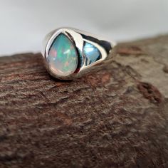 Opal Ring, 925 Solid Sterling Silver Ring, 22k Gold Fill, Signet Ring, Mens Ring, Gemstone Ring, Birthstone Ring, Handmade Ring, Gift Ring All my design are original with Solid 925  Sterling Silver stamp. Stone: Opal Size: all size ring Stone shape: Pear Setting: Handmade This ring is for women and men You will receive a Ring like the one in the photos This Ring have 925 Stamp Suitable for use in everyday situation s, or can also be use as a gift for her/him. Unique and beautiful design will mak Unique Silver Pear-shaped Rings, Handmade Silver Opal Teardrop Ring, Handmade Silver Teardrop Opal Ring, Handmade Silver Pear-shaped Rings, Handmade Pear-shaped Silver Rings, Pear Shaped Sterling Silver Ring For Gift, Pear Shaped Multi-stone Ring As Gift, Silver Pear-shaped Ring With Birthstone, Pear Shaped Multi-stone Ring For Gift