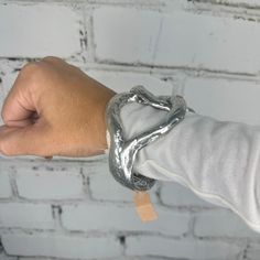 Silver Fashion Bracelet. Trendy Silver Cuff Bracelet, Trendy Metal Heart Bangle Bracelet, Silver Heart Bangle Bracelet For Parties, Trendy Silver Heart Bangle Bracelet, Silver Heart Bangle For Party, Trendy Metal Stretch Bracelet For Party, Trendy Spring Bracelets For Party, Silver Bangle With Bracelet Strap, Trendy Silver Bracelets For Spring