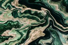 an aerial view of green and black marble