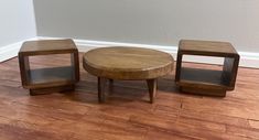 three wooden tables sitting on top of a hard wood floor