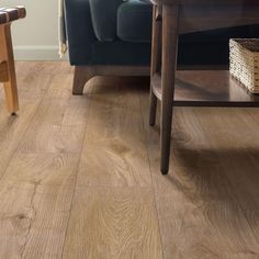 a living room with wooden floors and furniture