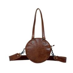 This remarkable Long Time Traveler bag is remarkably unique. It presents a classic western-style round design with hand stitched leather detail, with hair-on animal hide for the body. Brown leather backing and an adjustable strap complete the form and function. Convenient zippered opening, with roomy main compartment for all your important items while you're on the go. Item Width 10.8" Item Depth 2.5" Item Height 10.5" Shoulder 18" Handle 12.5" Note that the exact pattern of the hair-on hide and leather as pictured may vary slightly due to the crafted nature of the item. Fringe Crossbody Purse, Hidden Colors, Animal Hide, Everyday Purse, Time Traveler, Leather Detail, Round Design, Stitching Leather, Large Bag