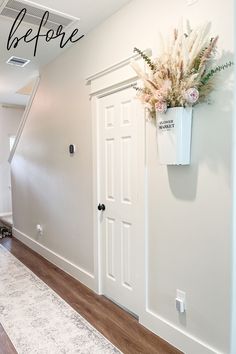 an empty room with white walls and wood flooring that has the words before painted on it