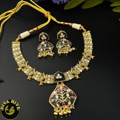 Our special Handcrafted fusion necklace is curated on brass ,hand painted and meena work on real stones pendant. This is a absolutely gorgeous and trending Piece.Metal: Brass with 92.5 SilverPolish: Gold Nickel FreePerfect for all occasion(Party, Wedding ,Engagement)Note: This product is handcrafted and vintage, it has slight irregularities in design which only add to its beauty. Due to the differences in displays of computers/laptops/phones or may be photographic lighting sources the color of t Fusion Kundan Necklaces, Kundan Fusion Necklace, Fusion Style Kundan Round Necklace, Round Kundan Fusion Necklace, Meenakari Necklaces As Gifts, Unique Hand Painted Necklaces For Festivals, Meenakari Pendant Jewelry For Puja, Hand Painted Enamel Jewelry For Wedding, Hand Painted Enamel Jewelry For Weddings