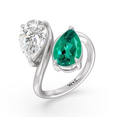 Pick this ring if you're searching for a modern minimalist engagement ring that tells a story and tells it in a simply romantic way. This toi et moi or you-and-me ring perfectly depicts the meeting of two souls. It features a slim yet curvy bypass shank, with each end topped with a pear-cut created Emerald and diamond on a three-prong basket setting. Timeless Sterling Silver Rings For Proposal, White Gold Brilliant Cut Emerald Ring For Proposal, Modern Emerald Ring Vvs Clarity For Promise, Modern Emerald Promise Ring With Vvs Clarity, Minimalist Brilliant Cut Jewelry For Proposal, Modern Emerald Ring With Center Stone, Emerald Solitaire Diamond Ring For Proposal, Solitaire Diamond Open Ring For Proposal, Solitaire Diamond Ring With Emerald For Proposal