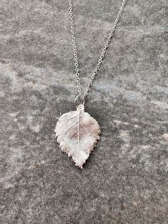 Unique handmade silver pendant made from a Silver Birch leaf from East Sussex, England With an 18 inch sterling silver chain. Please note-no hallmark on the pendant, but it is fine silver. Comes with a box Silver Leaf-shaped Nature-inspired Necklace, Handmade Sterling Silver Leaf-shaped Necklace, Handmade Sterling Silver Leaf Necklace, Handmade Silver Leaf-shaped Necklace, Silver Leaf-shaped Sterling Silver Necklace, Sterling Silver Leaf Necklace, Birch Leaf, Sussex England, Real Leaf