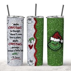 two christmas themed tumblers are shown with the grin face on one side and santa's hat on the other