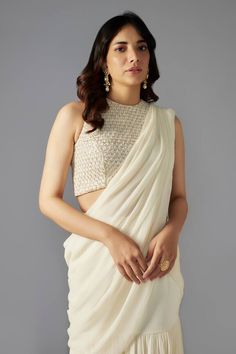 Ivory mermaid pre-draped saree in a solid base with tiers. Comes with padded blouse embellished by sequin and bead scallop patterns. - Aza Fashions Elegant Pre-draped Saree With Pearl Embroidery For Evening, Elegant Fitted Pre-draped Saree With Pearl Embroidery, Elegant Pre-draped Saree With Pearl Embroidery, Elegant Blouse With Pearl Embroidery And Traditional Drape, Elegant Off-white Georgette Pre-draped Saree, Elegant Evening Pre-draped Saree With Pearl Embroidery, Elegant Sleeveless Blouse With Pearl Embroidery, Elegant Cream Georgette Blouse Piece, Elegant Off White Pre-draped Saree With Unstitched Blouse