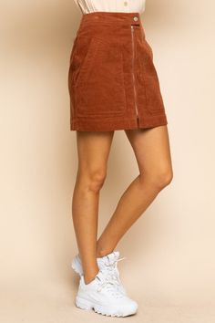 You'll be looking all kinds of 'cordially' fashionable in this Corduroy Mini Skirt In Rust Brown! Look lux in this comfy and chic skirt - made of high-quality corduroy and featuring a rust brown hue, you're sure to stand out in style. So let's get 'corduroy' underway! High-Waisted Fit A-Line Short Length Button Closure Exposed Front Zipper Front Patch Pockets Back Welt Pockets Soft Corduroy Unlined 100% Cotton Hand Wash Cold, Lay Flat to Dry Imported Small: Length 17" Waist: 27" Medium: Length 1 Navy Corduroy Skirt Outfit, Corduroy Skirt Outfit, 70s Skirt, Chic Skirt, Corduroy Mini Skirt, Chic Skirts, Zipper Skirt, A Line Shorts, Jumpsuits And Romper