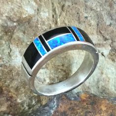 https://www.blackarrowgallery.com/collections/david-rosales-inlaid-sterling-silver-collection/products/david-rosales-black-beauty-inlaid-sterling-silver-ring-10 Modern Black Jewelry, Black Sterling Silver Jewelry With Inlay, Black Inlay Round Ring, Black Ring With Inlay, Black Rings With Inlay, Elegant Black Rings With Inlay, Modern Anniversary Rings With Inlay, Modern Silver Rings With Inlay, Modern Silver Ring With Inlay