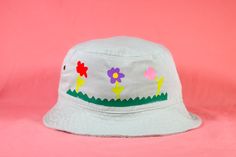 Level up your flower power with this cute bucket hat. What are these hats made of?‣ Hats are 100% cotton and have 4 brass eyelets for ventilation.‣ The head measurement of this hat is about 23 inches.How are these hats made?‣ Designs are applied with heat transfer vinyl.‣ I embellish each hat by hand, so please allow for slight variations from the photos. This just means that there is no hat exactly like yours. :)‣ Colors may vary slightly due to monitor or screen differences. For shipping infor Green Bucket Hat, Cute Bucket Hat, Free Printable Cards, Make Design, Transfer Vinyl, Hat Making, Printable Cards, Heat Transfer Vinyl, New Shop