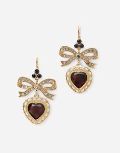 Technical specifications. Gold 18 Kt. Gemstones. 2 heart-shaped red rhodolite garnets, 46 round grey sapphires, 6 round black sapphires. Made in Italy. Ace Design, Fantasy Accessories, Dolce Gabbana Jewelry, Dolce And Gabbana Earrings, Aesthetic Jewellery, Red Gothic, Garnet Heart, Fashion Archive, Deep Autumn