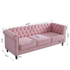 a pink couch with measurements for it