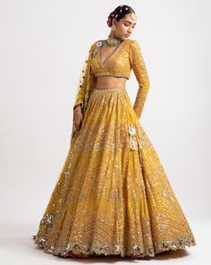 Intricately hand embroidered with thread zari and sequins sweetheart blouse, lehenga and a heavy mirror cut work net dupatta.From Vvani Vats Rang's collection.DELIVERY TIMEPlease allow 8-12 weeks for your outfit to arrive.FABRIC DETAILSNet, Georgette, Silk BlendProfessional cleaning only. Multi Color Lehenga, Sweetheart Blouse, Lehenga And Blouse, Blouse Lehenga, Lehenga Dupatta, Zipper Blouse, Yellow Lehenga, Net Blouses, Georgette Dupatta